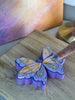Pressing a butterfly wing to demonstrate the clicker