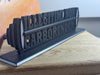 Angled view of Illegitimi Non Carborundum 3D printed desk sign