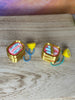 Classic and open sardine clicker keychain variants shown together