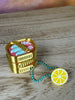 Open sardine clicker keychain shown from an angled top view