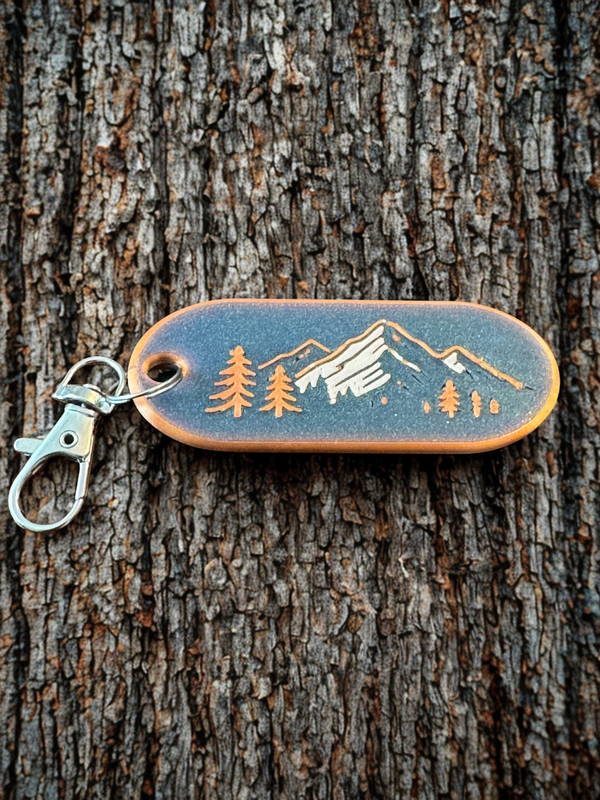 Engraved Summit Pine mountain keychain with evergreen and peak design